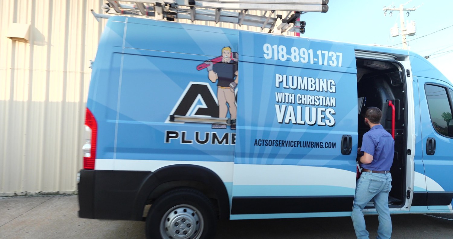 Acts of Service Plumbing service van at the shop